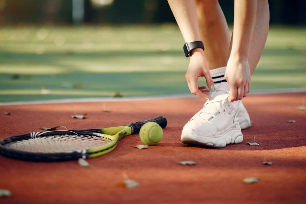 Beautiful and stylish girl on the tennis court