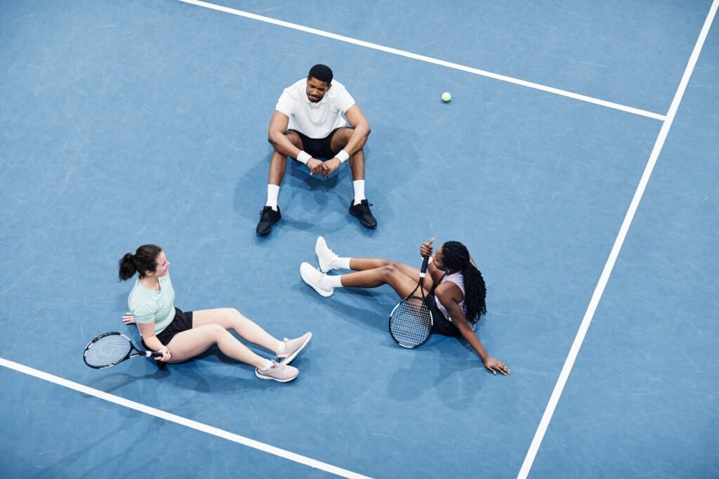 Team Relaxing at Tennis Court